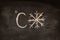 Celsius icon and snowflake drawn on chalkboard. Weather forecast.