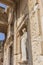 Celsus library and sculpture in Ephesus ancient city ruins on cloudy sky in Izmir, Turkey