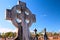 Celtic cross blue sky graveyard