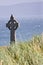 Celtic cross in a field in Inisheer, Ireland