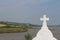 Celtic Cross Wild Atlantic Way background and green landscape