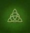 Celtic Trinity Knot or Triquetra against green background