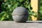A cement ball on metal surface