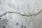 Cement cracks texture in the wall background