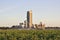 Cement plant and blueberry field at sunset