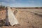 Cement road beacon on the side of a deserted desert road