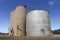 Cement and steel grain tower silos between Rochester and Dingee, Australia, in a blue sky