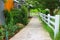 Cement walkways in gardens with shady trees, adding ozone