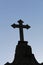 Cemetery cross under blue sky