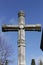 Cemetery cross under blue sky