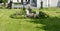 A cemetery or monument with a cross. Decorated with flowers