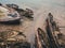 Cemetery of old ships Teriberka Murmansk Russia, wooden remains of industrial fishing boats in sea. Industrialization