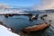 Cemetery of small fishing boats in Teriberke at sunrise. Murmansk region, Russia