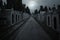 Cemetery street in an overcast full moon night