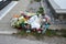 Cemetery waste and garbage. Piled up rubbish left strewn next to graves at the cemetery