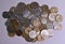 Cenital view of a pile of peseta coins with white background