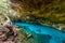 Cenote Dos Ojos in Quintana Roo, Mexico. People swimming and snorkeling in clear blue water. This cenote is located close to