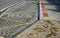 center. beveled concrete curbs a transport hub with flowers and grasses in the middle of the circle. perennial flowerbed