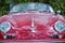 Center front red vintage retro 1958 Porsche 356 Speedster sports motor car