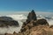 Center of Gran Canaria. Spectacular aerial view of volcanic rocks above the white fluffy clouds. Beautiful sunny day with clear,