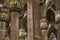 Center Nave columns inside interior Duomo di Milano. with statues serving crowns.