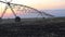 Center pivot irrigation at sunset 4