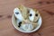 Centered closeup view of ripe cherimoya fruit Annona cherimola broken into pieces with seeds exposed