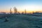 Centered path between trees during a winter sunrise