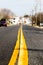 Centered road with old painted yellow road lines