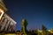 Central building of count Potocki palace, Tulchyn, Vinnytsia region, Ukraine, on a warm spring night against clear dark blue sky