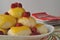 Central European dessert a version of Austrian Germknoedel of steamed sweet dumplings with fruit filling and hot f