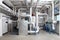 Central heating and cooling system control in a boiler room