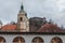 Central Market of Ljubljana, taken during a cloudy rainy day, the Ljubljana Cathedral, and Ljubljana Castle can be seen