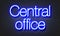 Central office neon sign on brick wall background.