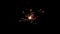 Centrally positioned firework sparkler burning isolated