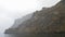 Centuries-old coastal cliffs on a cloudy day