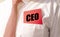 CEO acronym, chief executive officer text inscription on red paper note in pocket of white shirt of businessman