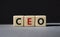 CEO - hief executive officer symbol. Concept word CEO on wooden cubes. Beautiful grey background. Business and CEO concept. Copy