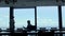 CEO silhouette checking report at panorama window. Man analyzing contract