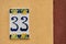 Ceramic background. Italian traditional patterns on tiles, handmade craft painting - numbers for apartments and houses. Number