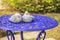 Ceramic birds on blue table
