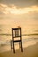 Ceramic birds on chair with seascape