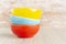 Ceramic bowl assorted colors on wooden background