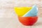 Ceramic bowl assorted colors on wooden background