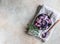 Ceramic bowl with colorful legumes and thyme, concrete background. Vegan high protein product. Top view. Copy space