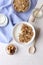 Ceramic bowl of Greek yogurt and mixed nuts. Nutritious vegetarian protein rich diet homemade breakfast with milk honey almond, ca