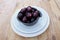 Ceramic bowl and plate with black muscadine scuppernong grapes