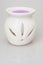 Ceramic candlestick with purple scented wax