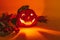 Ceramic candlestick in the shape of a Halloween pumpkin glows in the dark