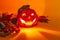 Ceramic candlestick in the shape of a Halloween pumpkin glows in the dark